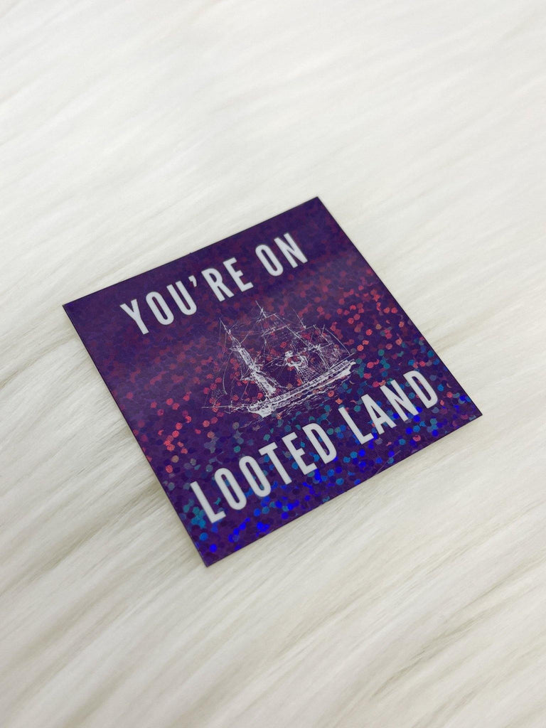 You’re on Looted Land Glitter Sticker - Bizaanide'ewin Beadwork & Supplies